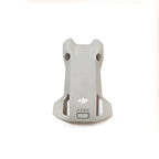 Gray DJI drone battery with four LED indicator lights on white background