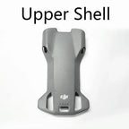 Gray upper shell drone cover with ventilation slots and DJI logo on white background