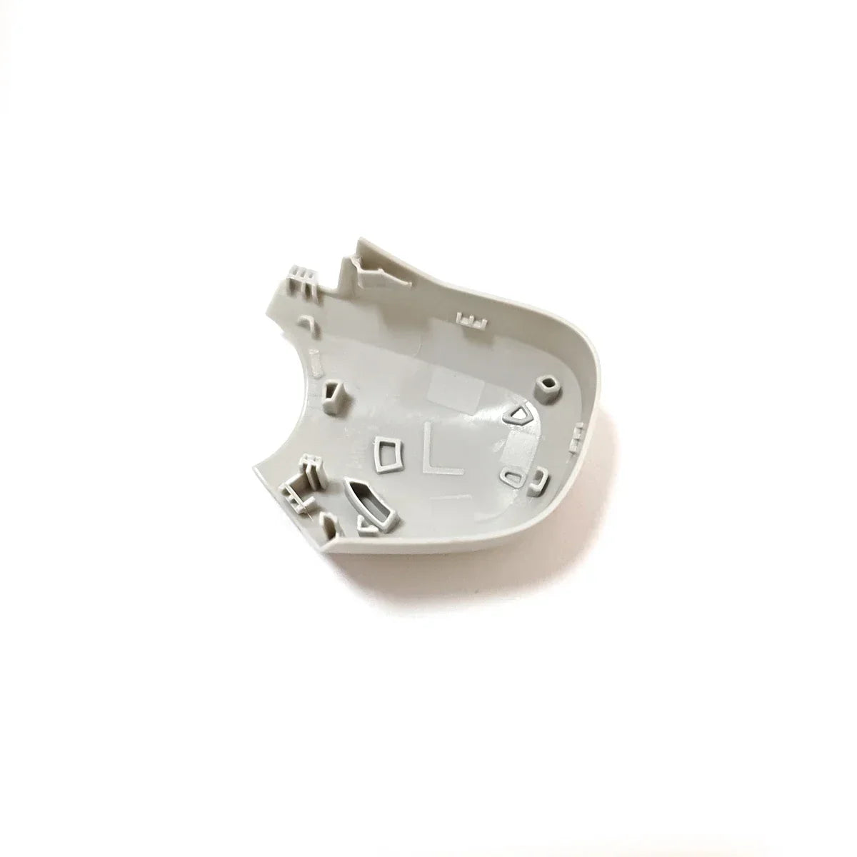 white plastic interior casing part with multiple compartments and structural supports on a white background