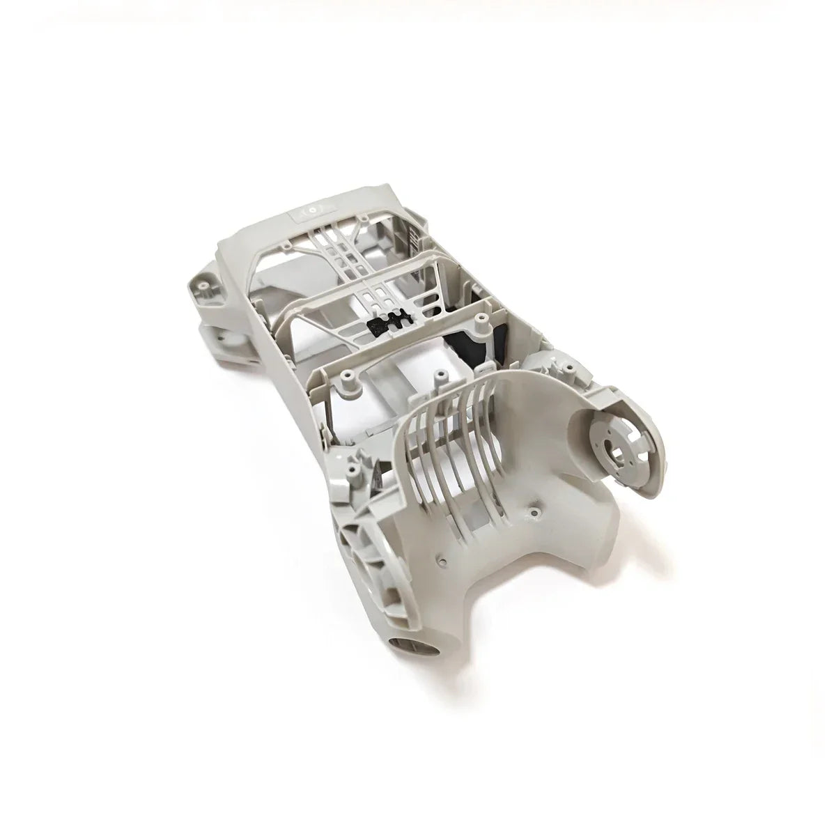 Gray plastic model car chassis shell with detailed framework isolated on white background