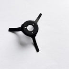 Black three-pronged plastic mechanical part with central hole on white background