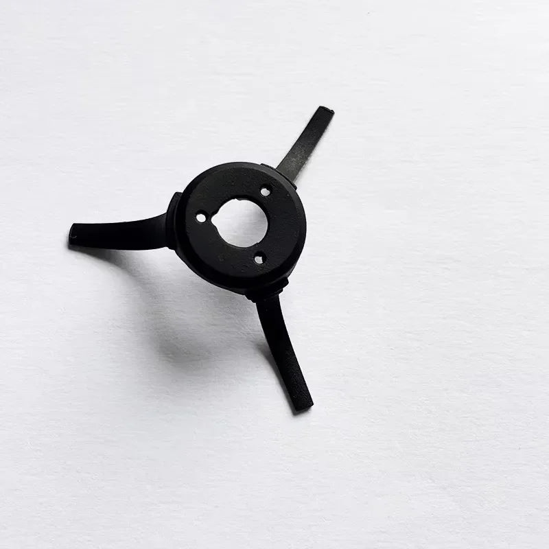 Black three-armed mechanical part with circular center and holes on white background