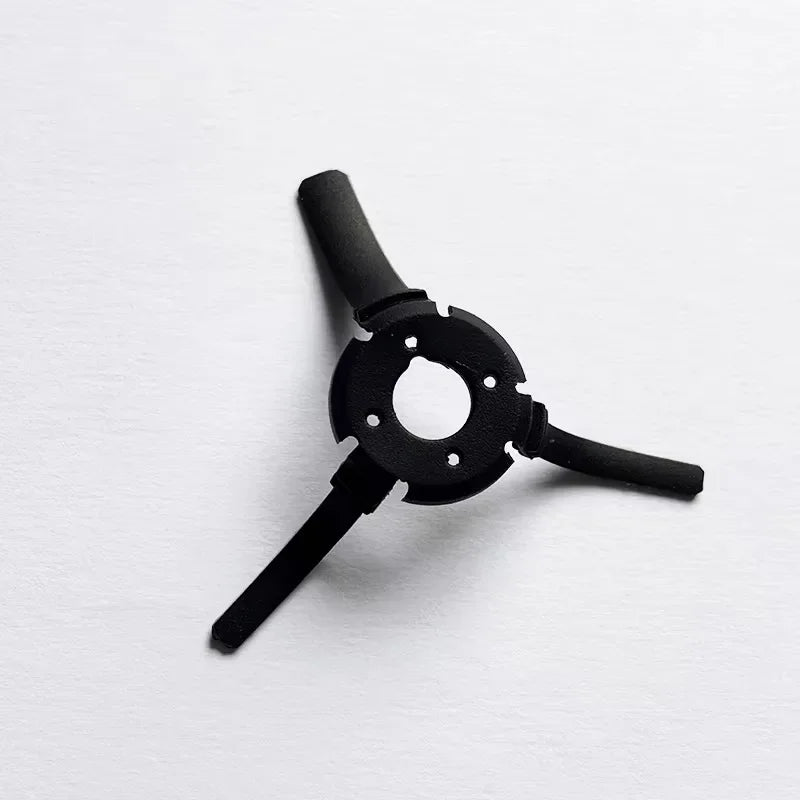 Black three-prong adapter tool on white background, small mechanical component
