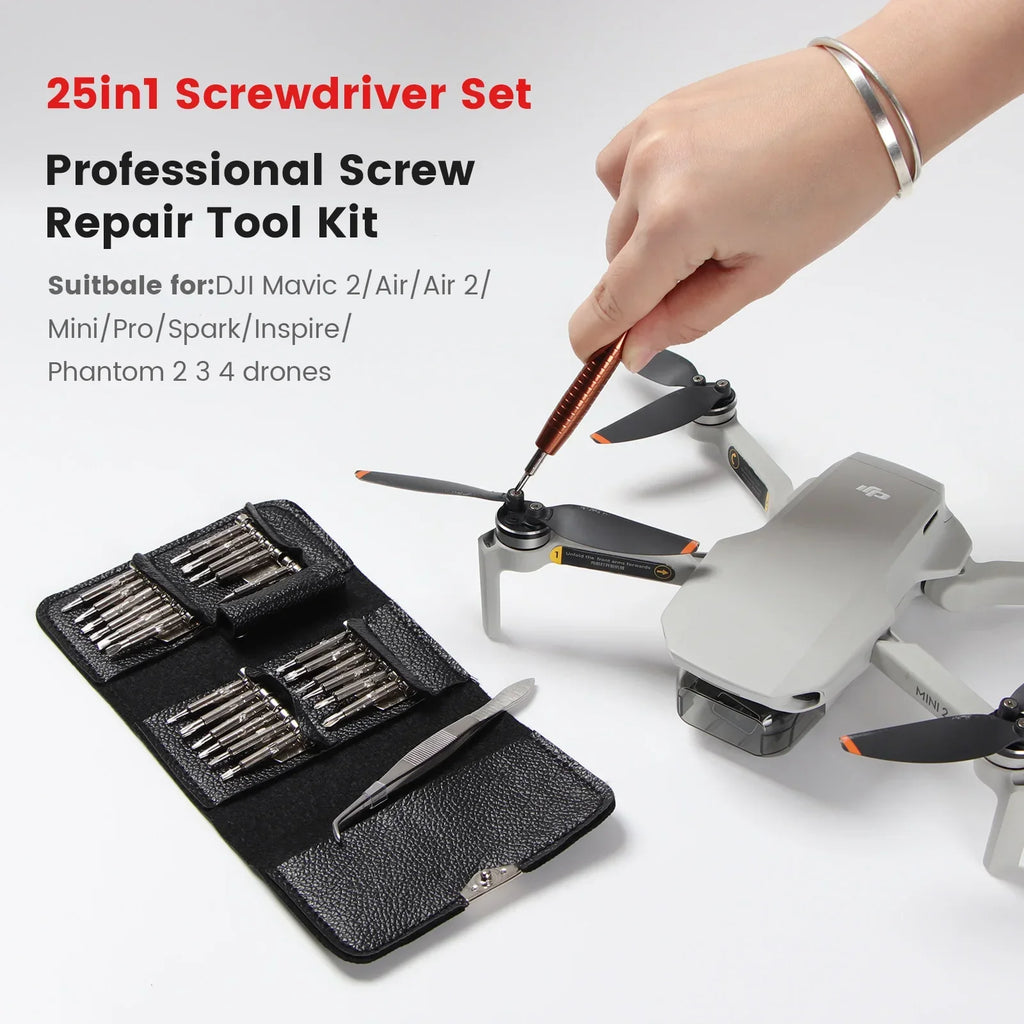 Hand using orange screwdriver from 25-in-1 tool kit to repair DJI drone propeller with tool case opened
